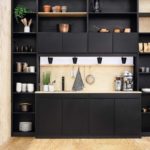 Impeccable design of a small kitchen in a dark color with a linear layout headset