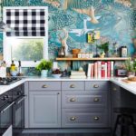 Design of a small kitchen with an unusual painted wall