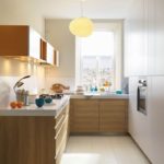 A beautiful lamp with an elegant ceiling will be a bright accent of a small kitchen
