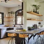 Small kitchen with lots of windows and a bar around the wall