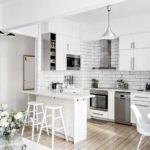 An example of harmoniously merging a small corner kitchen with a spacious living room