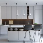 In a small kitchen, designers recommend dividing the lighting into main and decorative