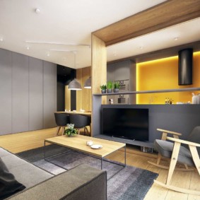 แผงสีเทาในการตกแต่งภายในของห้องนั่งเล่นห้องครัว